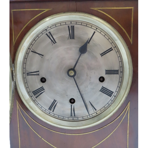 2161 - A REGENCY MAHOGANY WESTMINSTER CHIMING BRACKET CLOCKwith inlaid brass detail, the silvered dial with... 