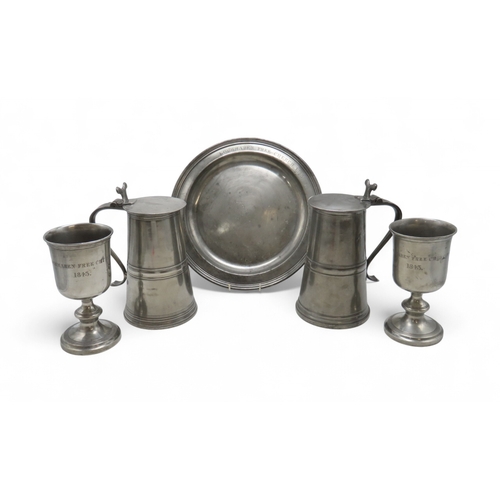 2164 - A PAIR OF SCOTTISH PEWTER FLAT-LID FLAGONS28cm high, together with a pair of large wine goblets, 22c... 