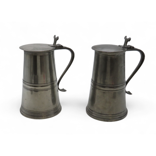 2164 - A PAIR OF SCOTTISH PEWTER FLAT-LID FLAGONS28cm high, together with a pair of large wine goblets, 22c... 