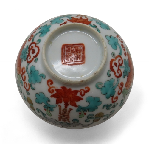 2272 - A CHINESE PORCELAIN CUPPainted with enamels depicting Shou symbols and bats, with single plum within... 