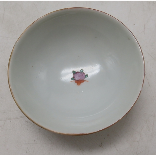 2272 - A CHINESE PORCELAIN CUPPainted with enamels depicting Shou symbols and bats, with single plum within... 