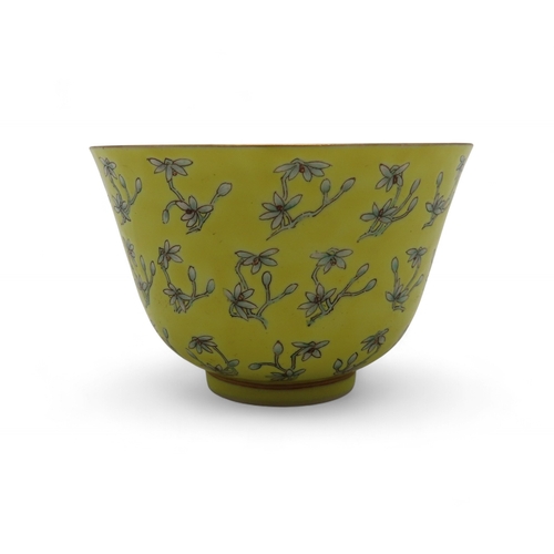 2273 - A CHINESE FAMILLE JAUNE BOWLPainted with flowers and buds, within gilt rims, iron red Tongzhi Nian Z... 