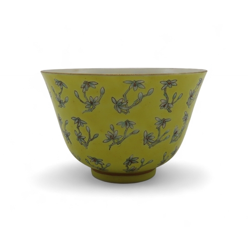 2273 - A CHINESE FAMILLE JAUNE BOWLPainted with flowers and buds, within gilt rims, iron red Tongzhi Nian Z... 