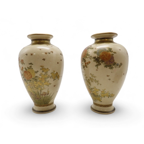 2281 - A PAIR OF SATSUMA VASESPainted with floral sprays and butterflies, beneath a diaper shoulder, signed... 
