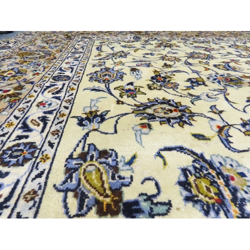 2004 - AN IVORY GROUND FINE KASHAN RUGwith all over floral/foliate patterned ground within beige flower hea... 