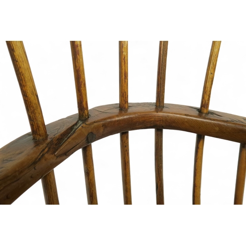 A 17TH CENTURY ELM COMB BACKED WINDSOR CHAIRwith unadorned back and ...