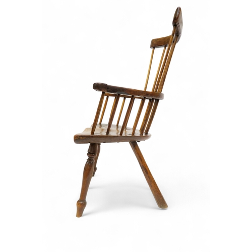 A 17TH CENTURY ELM COMB BACKED WINDSOR CHAIRwith unadorned back and ...