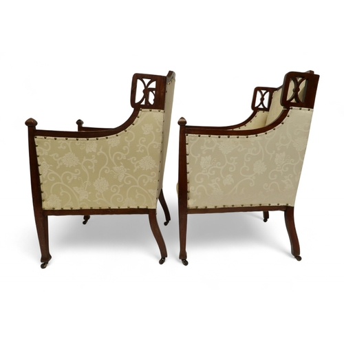 2030 - AN EDWARDIAN MAHOGANY FRAMED THREE PIECE PARLOUR SUITEconsisting two seater settee, 94cm high x 127c... 