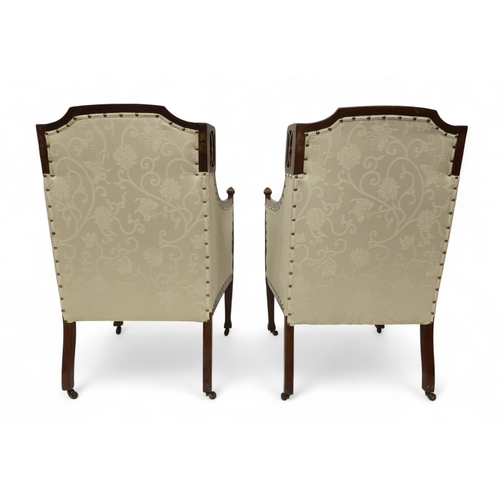 2030 - AN EDWARDIAN MAHOGANY FRAMED THREE PIECE PARLOUR SUITEconsisting two seater settee, 94cm high x 127c... 