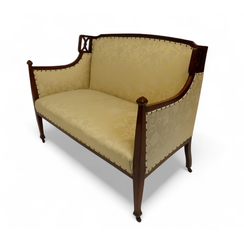 2030 - AN EDWARDIAN MAHOGANY FRAMED THREE PIECE PARLOUR SUITEconsisting two seater settee, 94cm high x 127c... 