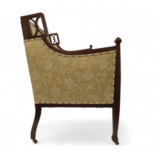 2030 - AN EDWARDIAN MAHOGANY FRAMED THREE PIECE PARLOUR SUITEconsisting two seater settee, 94cm high x 127c... 