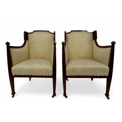 2030 - AN EDWARDIAN MAHOGANY FRAMED THREE PIECE PARLOUR SUITEconsisting two seater settee, 94cm high x 127c... 
