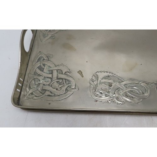 2211 - A GLASGOW SCHOOL WHITE METAL TRAYof rectangular form decorated with Celtic knotwork beasts, 35.5cm x... 