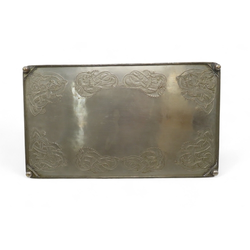 2211 - A GLASGOW SCHOOL WHITE METAL TRAYof rectangular form decorated with Celtic knotwork beasts, 35.5cm x... 