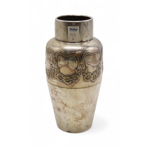 2214 - A WMF SILVER PLATED VASEwith a band of flowers above a hammered body, 26cm high... 