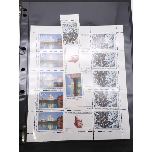 7069 - Russia From 1990 in Two Albums and a large Quantity of lose U/M stamps and Miniature Sheets on stock... 