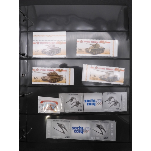 7069 - Russia From 1990 in Two Albums and a large Quantity of lose U/M stamps and Miniature Sheets on stock... 