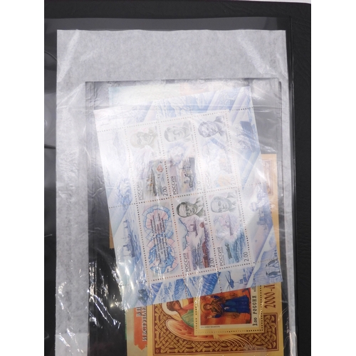 7069 - Russia From 1990 in Two Albums and a large Quantity of lose U/M stamps and Miniature Sheets on stock... 