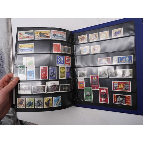 7089 - A collection of German and East German stamps in an album
