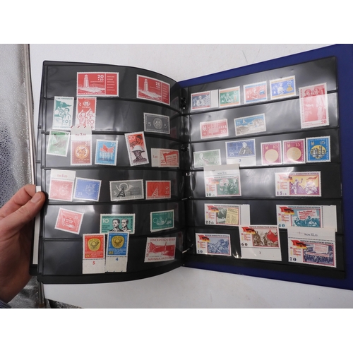 7089 - A collection of German and East German stamps in an album