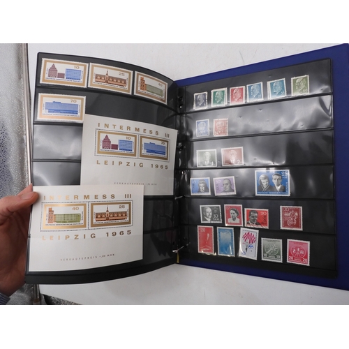 7089 - A collection of German and East German stamps in an album