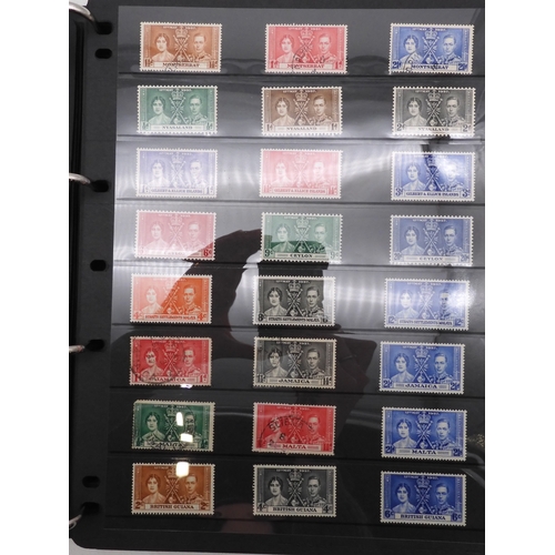 7085 - World Collection in Large 4 ring binder with Hagner Pages. Contains Many Stamps, both mint or used. ... 