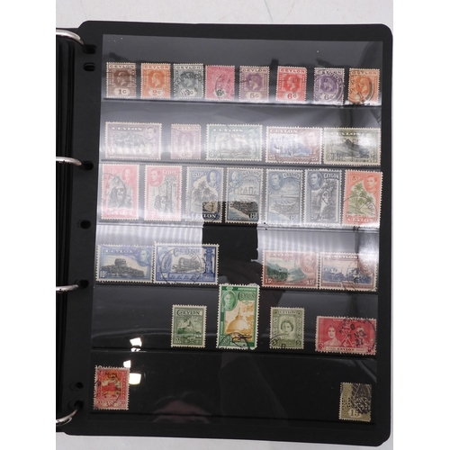 7085 - World Collection in Large 4 ring binder with Hagner Pages. Contains Many Stamps, both mint or used. ... 