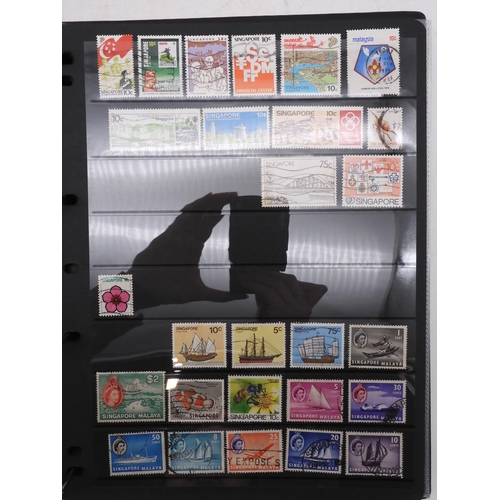 7085 - World Collection in Large 4 ring binder with Hagner Pages. Contains Many Stamps, both mint or used. ... 