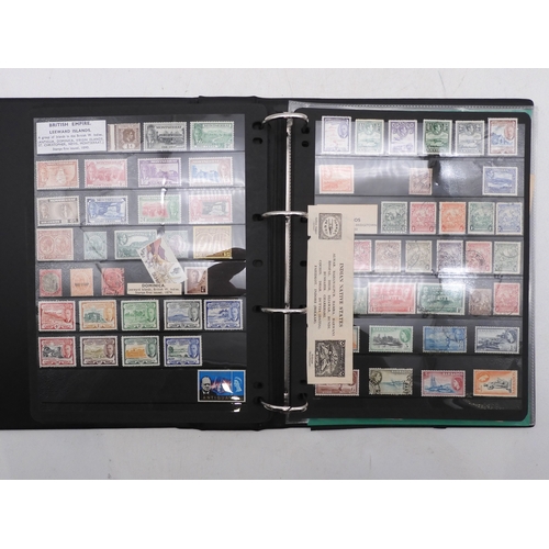 7085 - World Collection in Large 4 ring binder with Hagner Pages. Contains Many Stamps, both mint or used. ... 