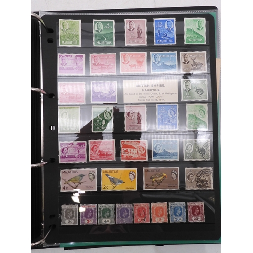 7085 - World Collection in Large 4 ring binder with Hagner Pages. Contains Many Stamps, both mint or used. ... 