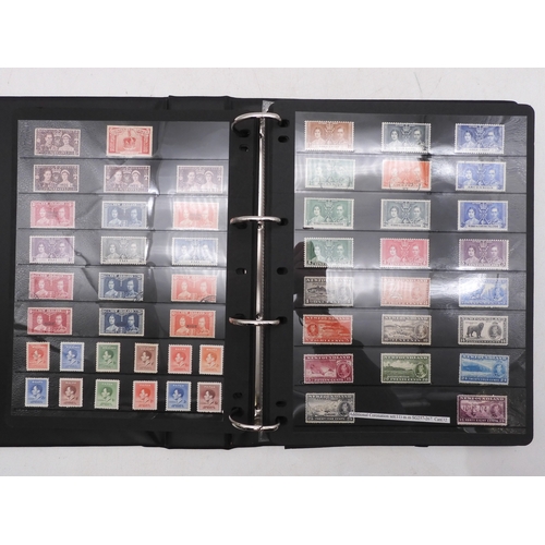 7085 - World Collection in Large 4 ring binder with Hagner Pages. Contains Many Stamps, both mint or used. ... 