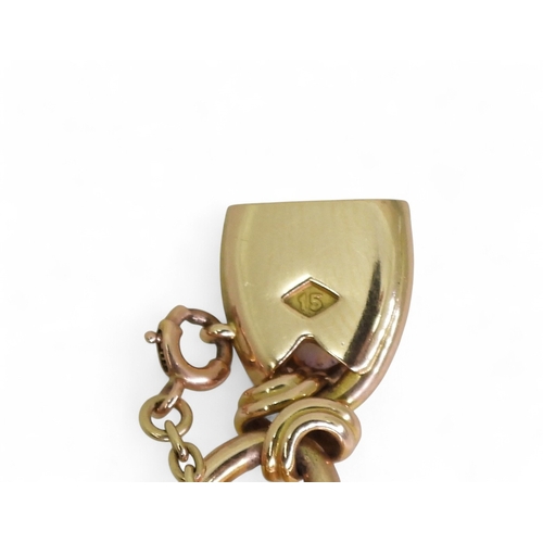 2733 - A 15CT GOLD OPAL BRACELETthe oval links are interspaced with gold knots, very lively opals, with ful... 