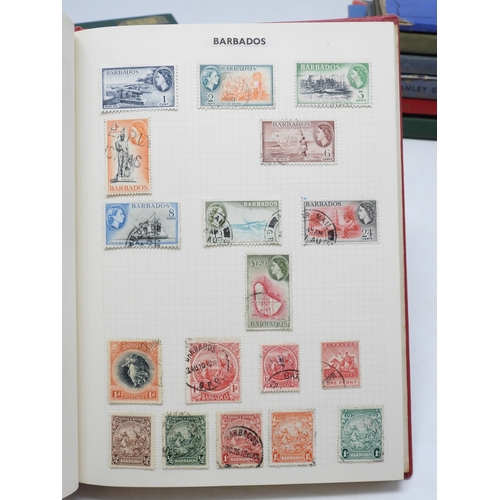 7108 - A lot comprising various stock books containing a world wide stamp collection to include GB 1/d red ... 