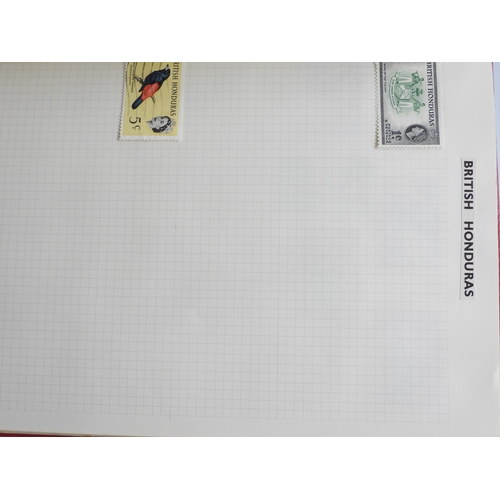 7108 - A lot comprising various stock books containing a world wide stamp collection to include GB 1/d red ... 