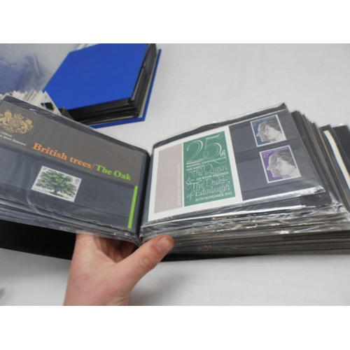 7111 - A lot comprising first day covers many with associated British Post Office Mint Stamps, Robert Burns... 
