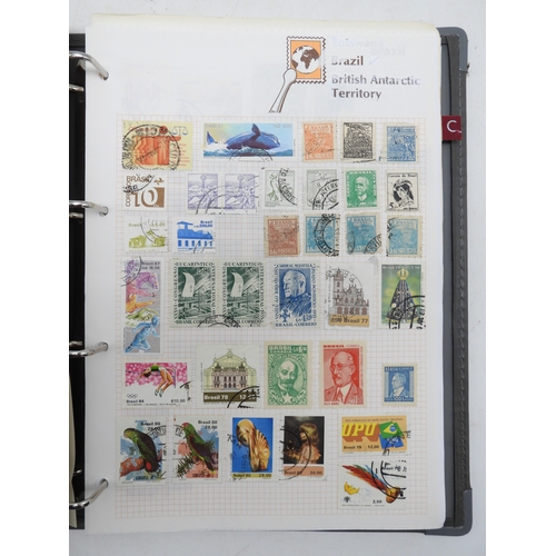 7129 - A worldwide stamp collection in five albums and two stock books