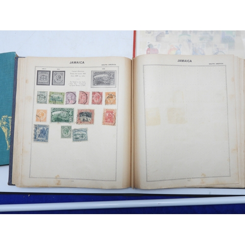 7130 - A worldwide stamp collection in four stock books together with an album of first day covers