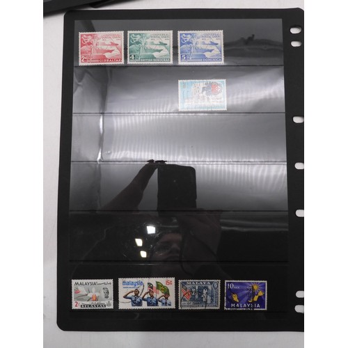 7083 - GB small collection of mint and used GB stamps on Hagner Pages plus 3 Presentation packs. Mixed cond... 