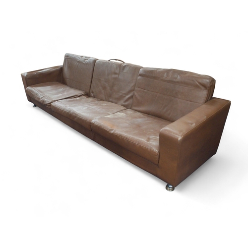 35 - A large mid to late 20th century brown leather upholstered settee on chromed supports, 78cm high x 2... 