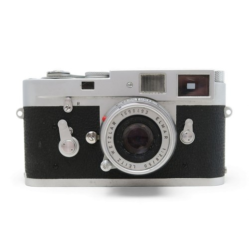 2555A - A LEICA M2 RANGEFINDER CAMERA, 1961Serial no. 1021649, fitted with a Leitz Wetzlar Elmar 1:2.8/50 le... 