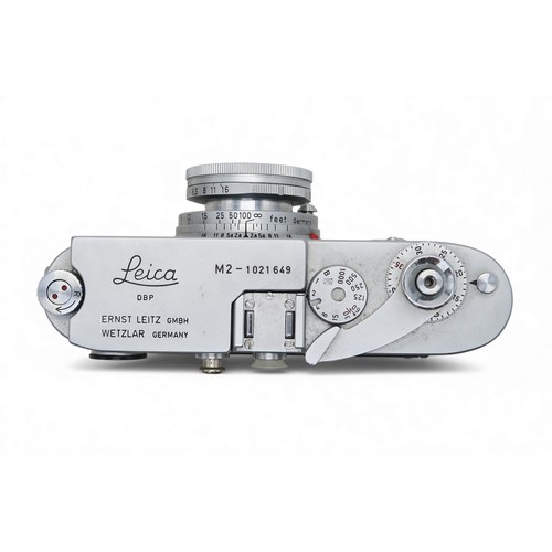 2555A - A LEICA M2 RANGEFINDER CAMERA, 1961Serial no. 1021649, fitted with a Leitz Wetzlar Elmar 1:2.8/50 le... 