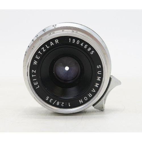 2555A - A LEICA M2 RANGEFINDER CAMERA, 1961Serial no. 1021649, fitted with a Leitz Wetzlar Elmar 1:2.8/50 le... 
