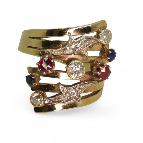A unique dress ring, made in 9ct gold and studded with diamonds rubies ...