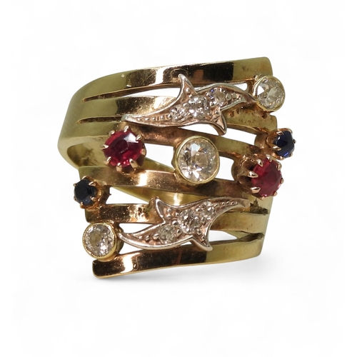 A unique dress ring, made in 9ct gold and studded with diamonds rubies ...