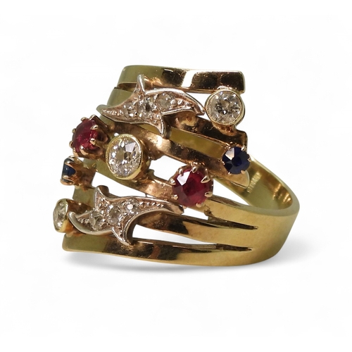 A unique dress ring, made in 9ct gold and studded with diamonds rubies ...