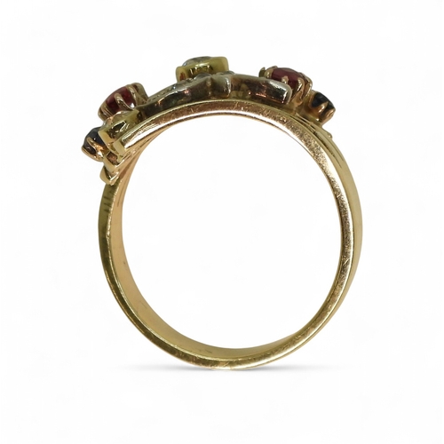 A unique dress ring, made in 9ct gold and studded with diamonds rubies ...