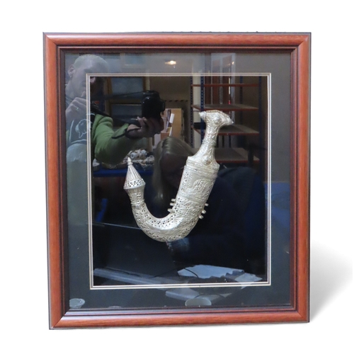 401 - A framed Saudi Arabian white metal breast piece, a lapis lazuli necklace and a Jambiya dagger&nbsp;