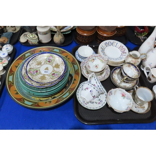 402 - A large Gouda plate decorated with chrysanthemums, Hornsea storage jars, assorted tea wares and plat... 