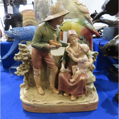 415A - A Royal Dux figure of a cockatoo, another of a Macaw, a planter modelled as a family group and two o... 