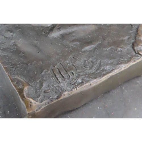 416 - After Miguel Fernando Lopez a contemporary bronze figure of a charging bull, on a black marble base,... 